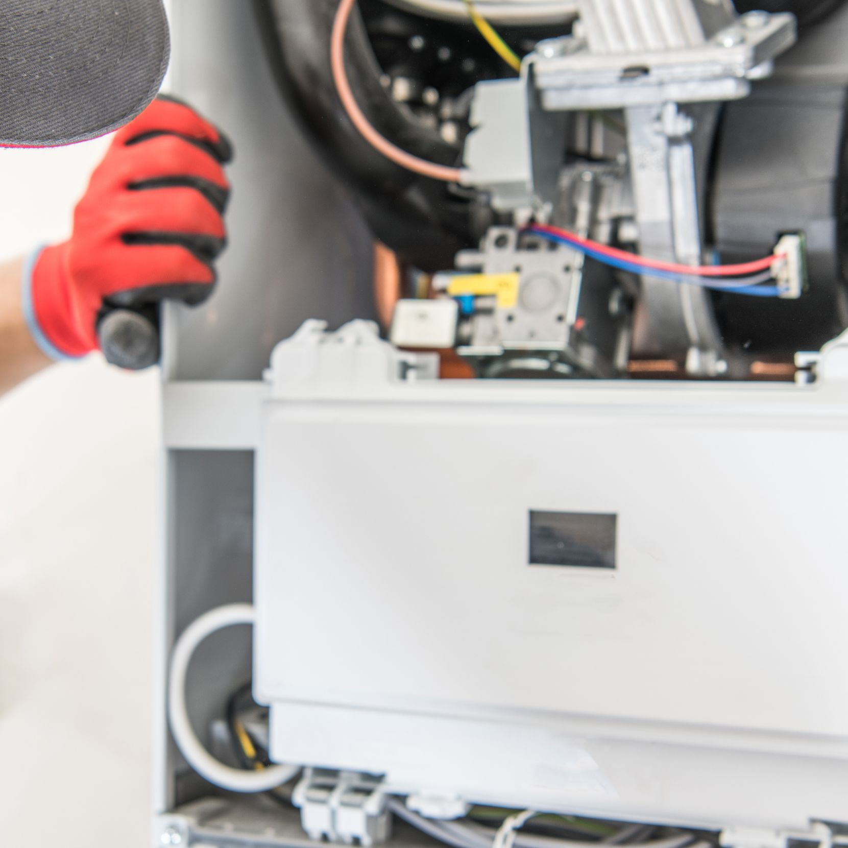 Technician repairing central heating system