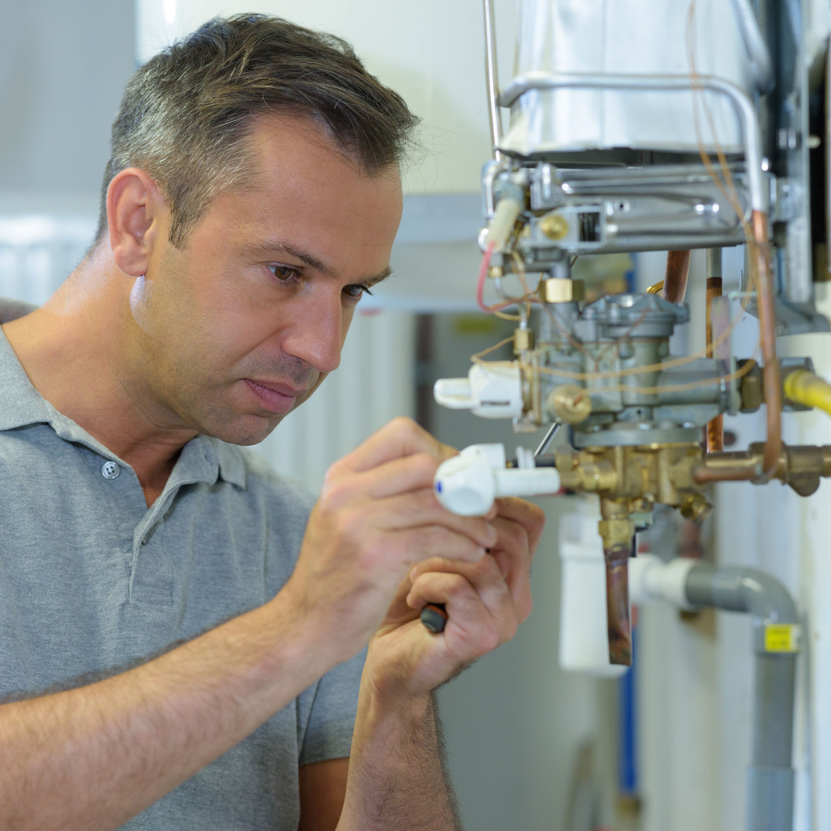 Technician working on a hot surface igniter